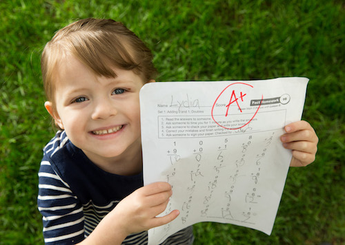 1505-42 039 1505-42 Schoolchild Illustration Photo Illustration of grade school child proudly displaying her grade to a parent. May 18, 2015 Photo Illustration by Jaren Wilkey/BYU © BYU PHOTO 2015 All Rights Reserved photo@byu.edu  (801)422-7322